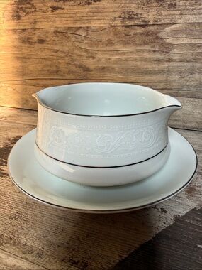 American Limoges White Porcelain Gravy Boat with Silver Trim and attached plate.